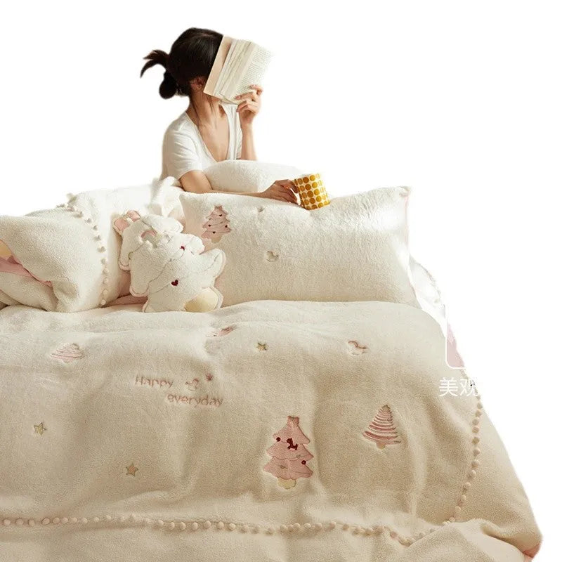 Milk fibre four-piece bed linen set with green Christmas tree pattern on a quilt cover and pillowcase.