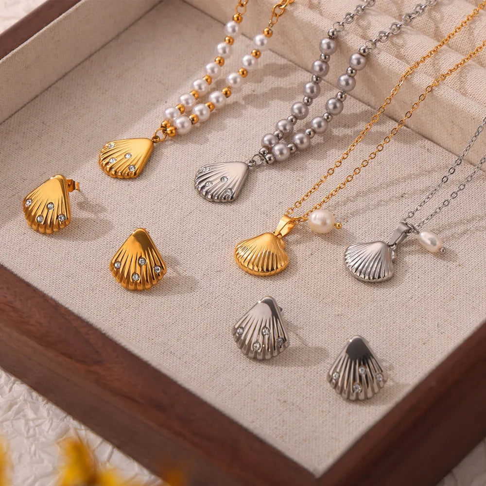 Gold titanium steel women's necklace featuring a French vintage shell pendant with freshwater pearl beads on an O-chain.