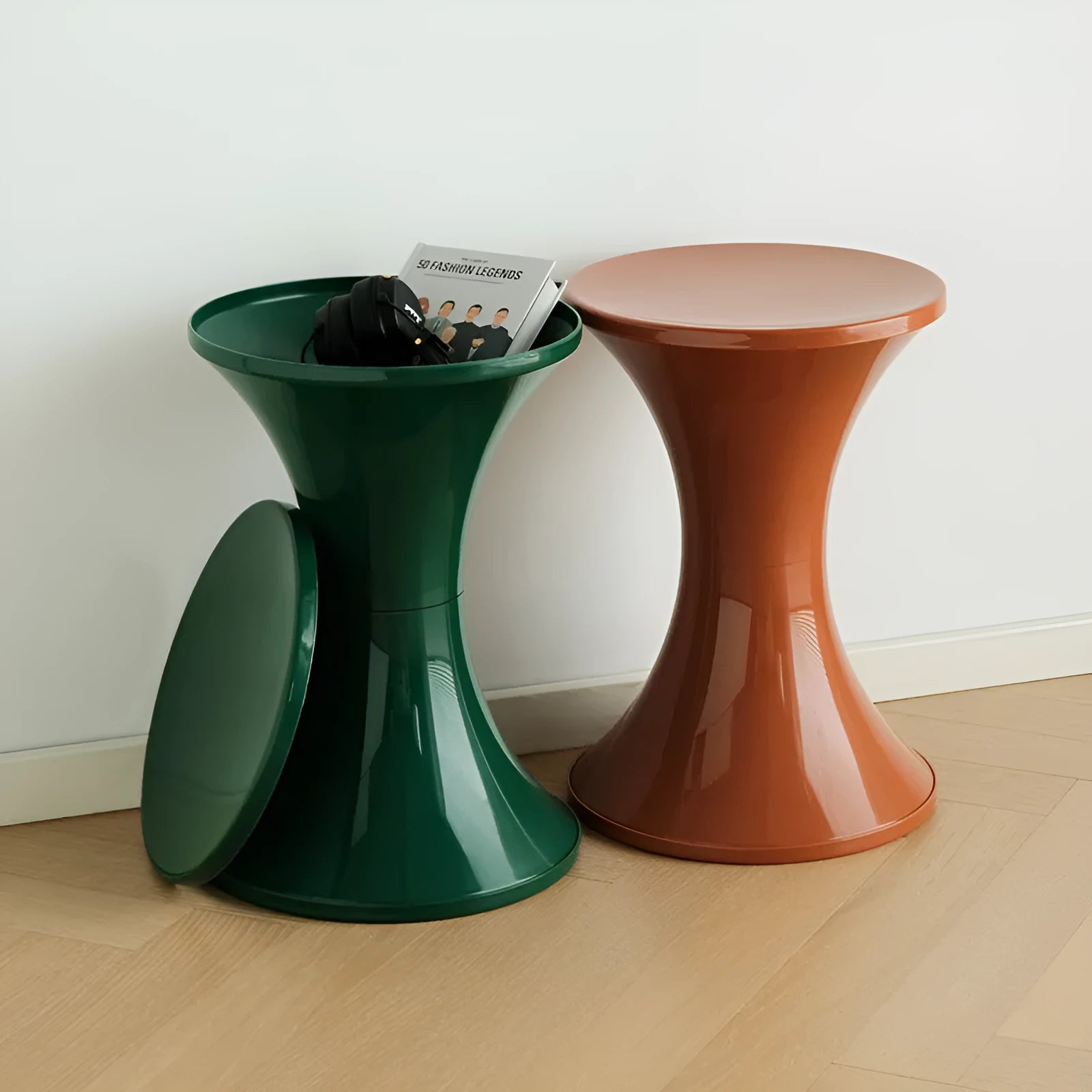 Plastic hourglass-shaped shoe changing stool shown in available colours.