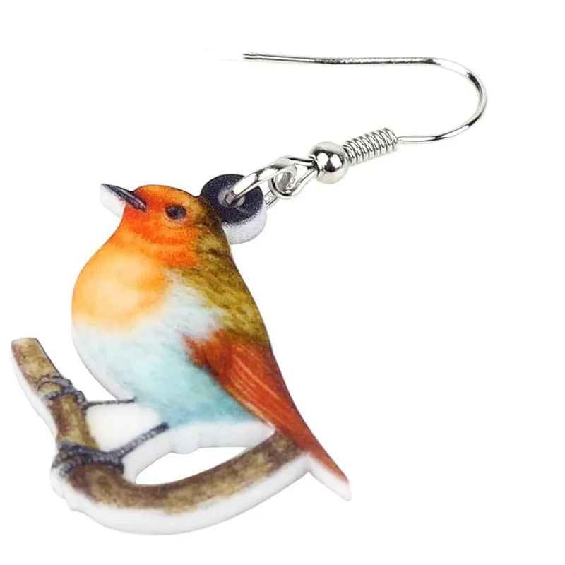 A pair of women's acrylic pendant earrings with a detailed Blue Titmouse bird design in a geometric style.