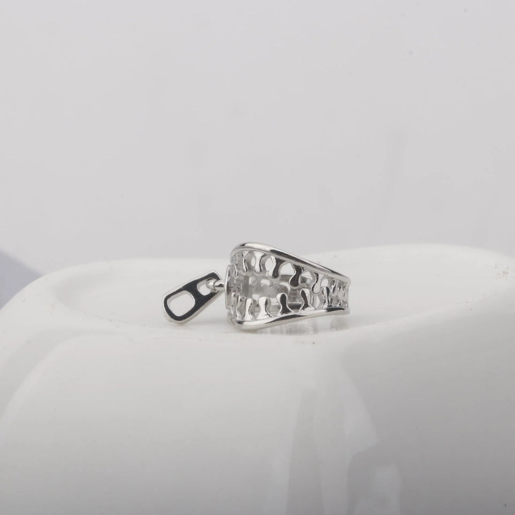 A pair of geometric copper clip-on earrings with linear design in colour ES862.