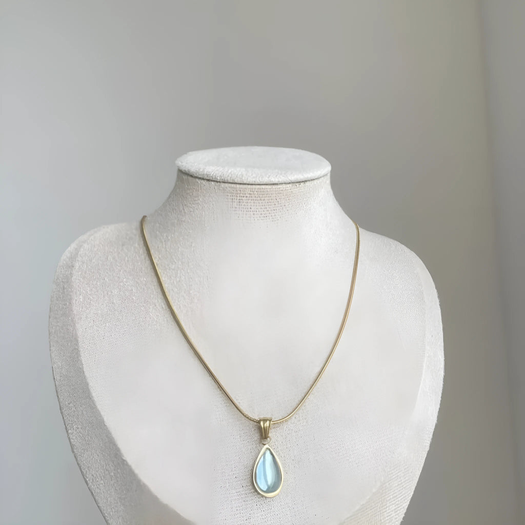 Retro titanium steel necklace with a blue or green water drop pendant featuring a mixed gem inlay.