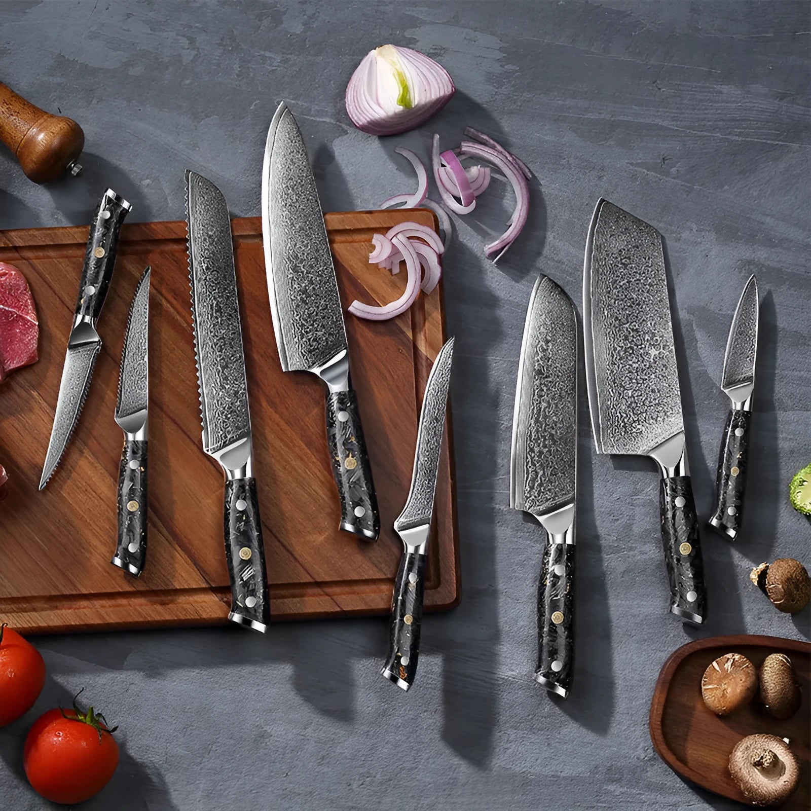 Eight-piece Damascus steel kitchen knife set showing fishbone pattern and different blade sizes