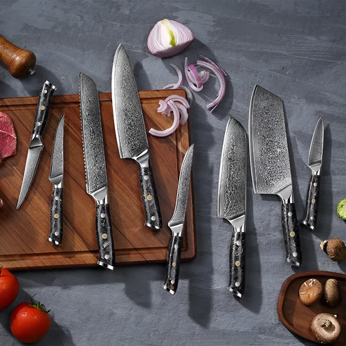 Eight-piece Damascus steel kitchen knife set showing fishbone pattern and different blade sizes