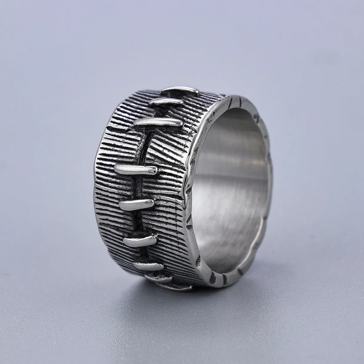 Dark punk style titanium steel ring with stitched geometric U-shape double ring design in retro colour.