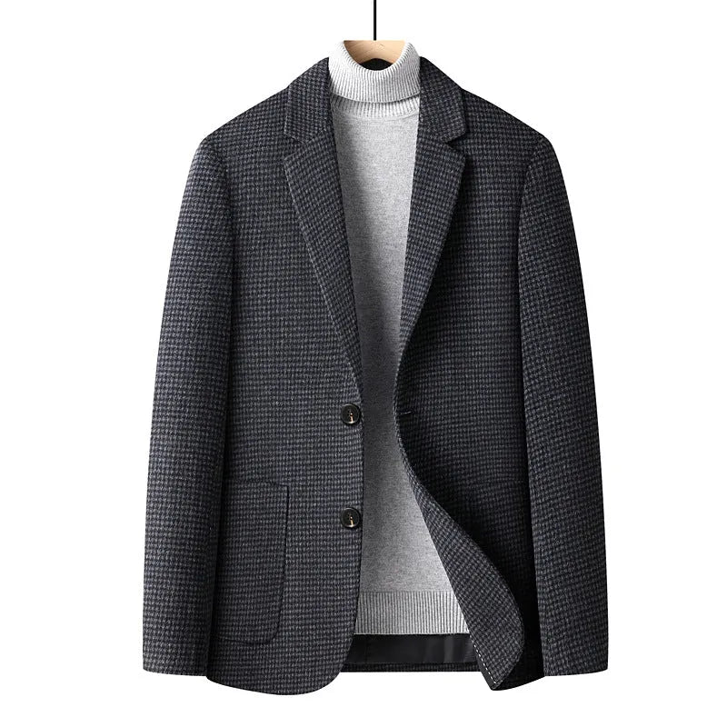 Men's slim fit wool suit jacket in grey on a hanger, showing notch lapel and button front.