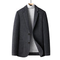 Men's slim fit wool suit jacket in grey on a hanger, showing notch lapel and button front.