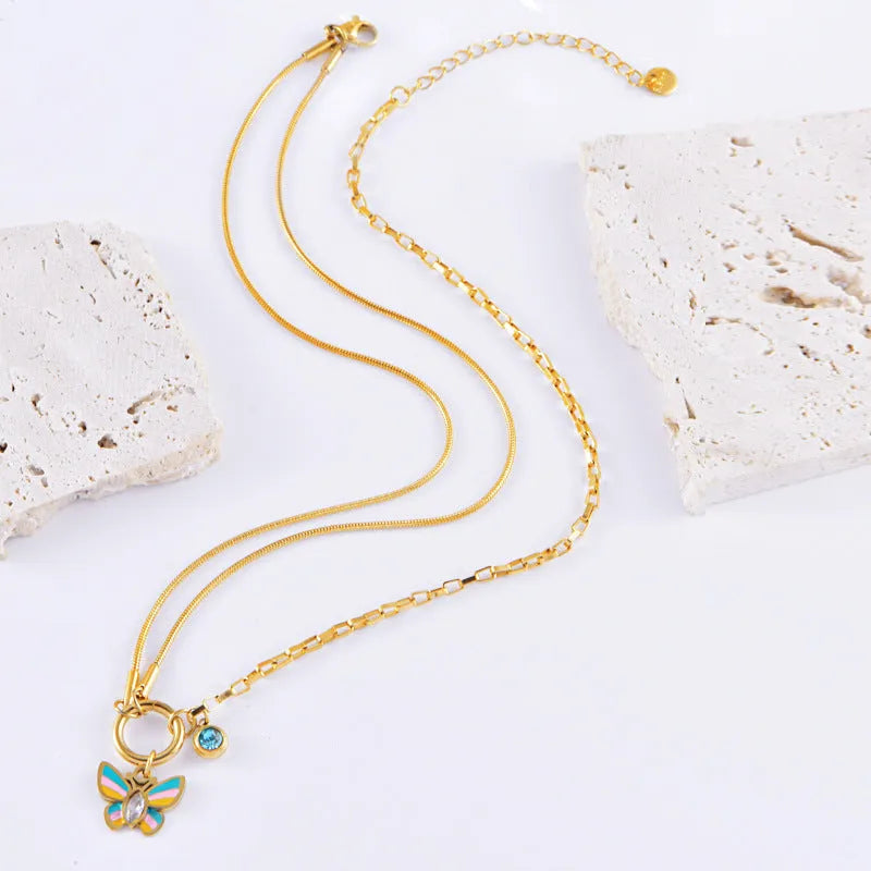 Gold epoxy butterfly necklace and bracelet set with titanium steel construction and zodiac animal pendant