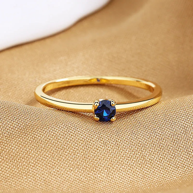 Women's personalised copper fine circle ring with single diamond geometric design in four colour options