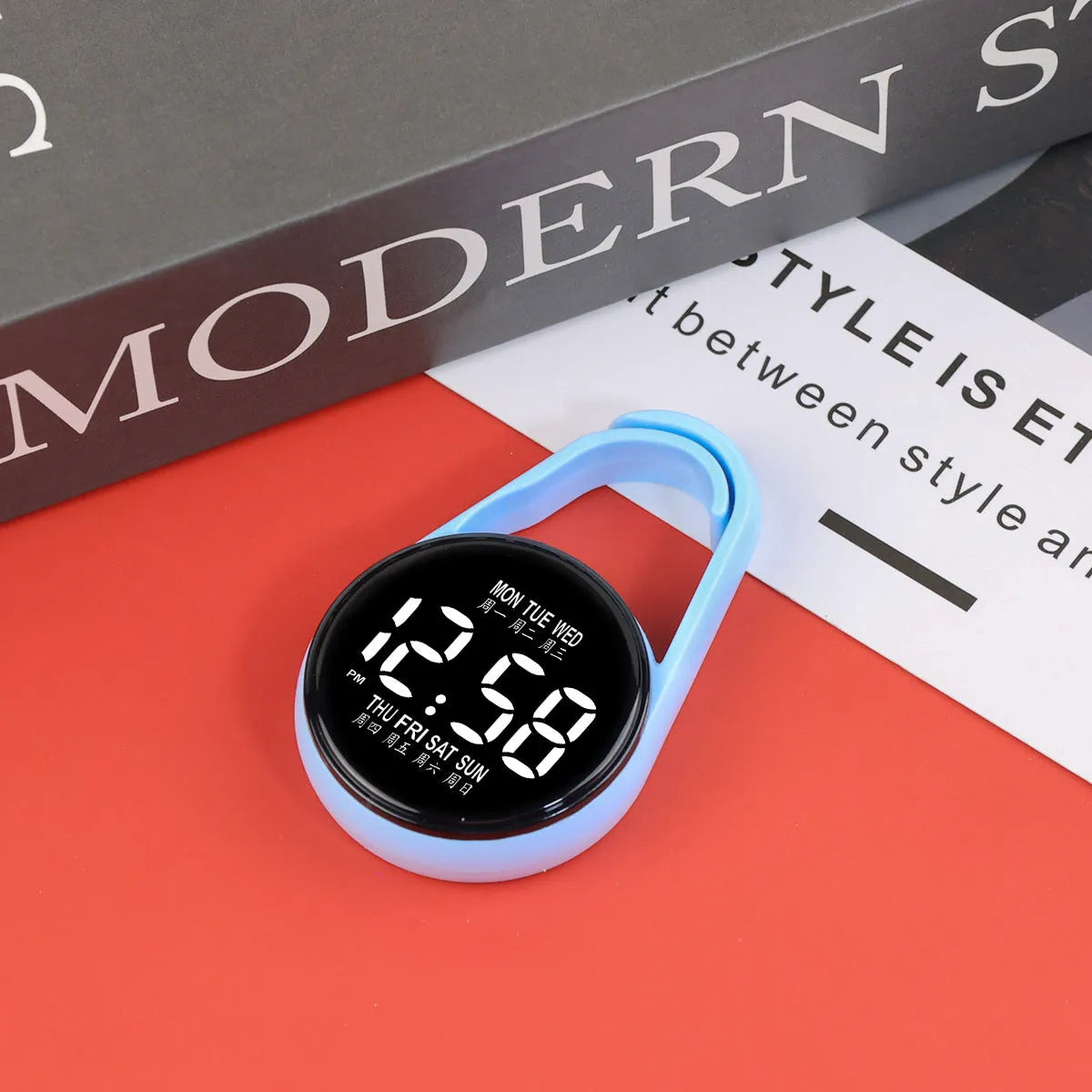 LED electronic watch with digital week display on an adjustable plastic strap, shown in various colours.