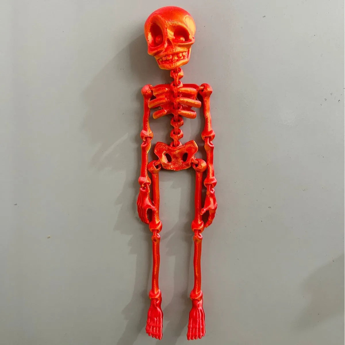 3D printed skull refrigerator magnet in various colours measuring 18cm tall