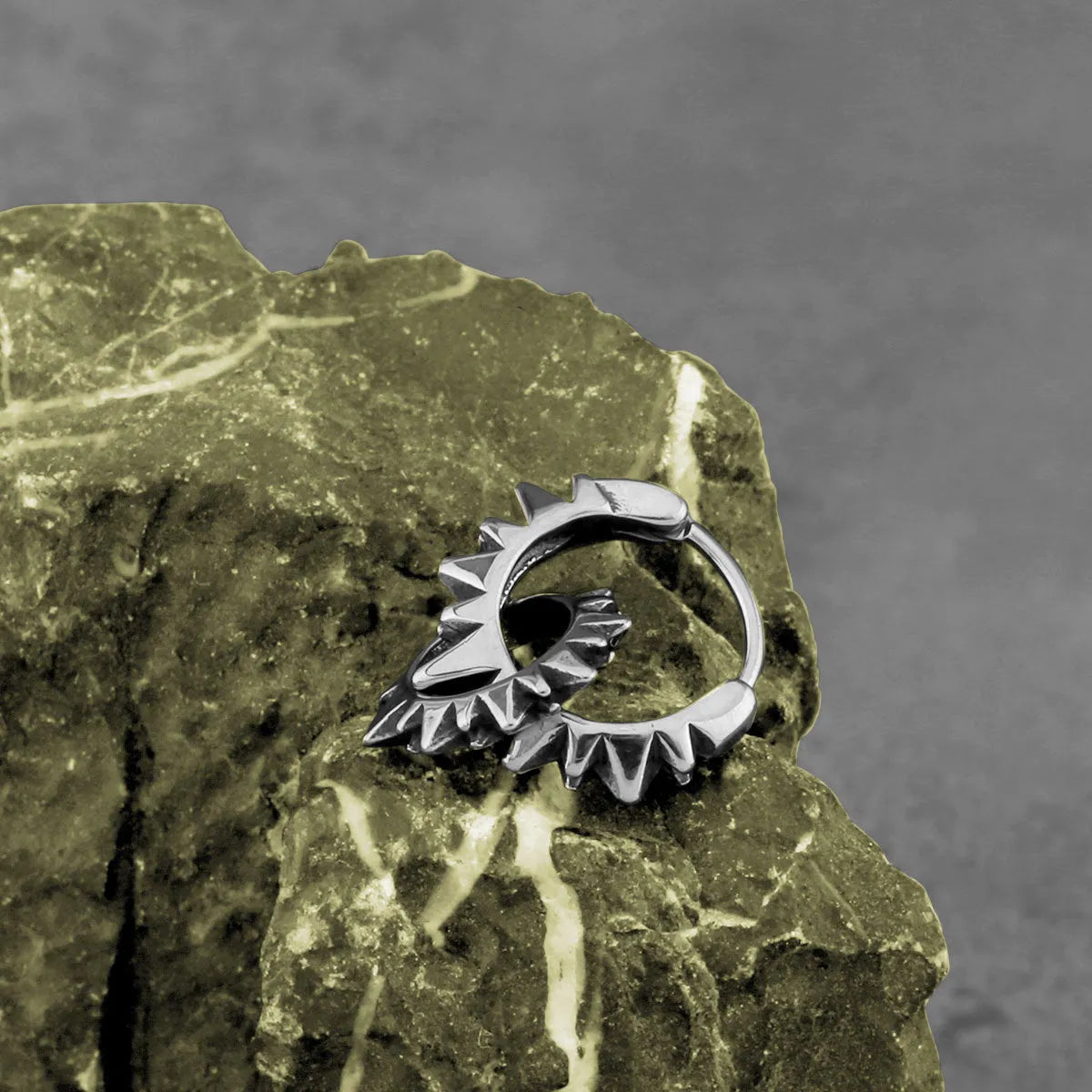 A pair of polished stainless steel round hoop earrings with a titanium steel finish in a steel colour.