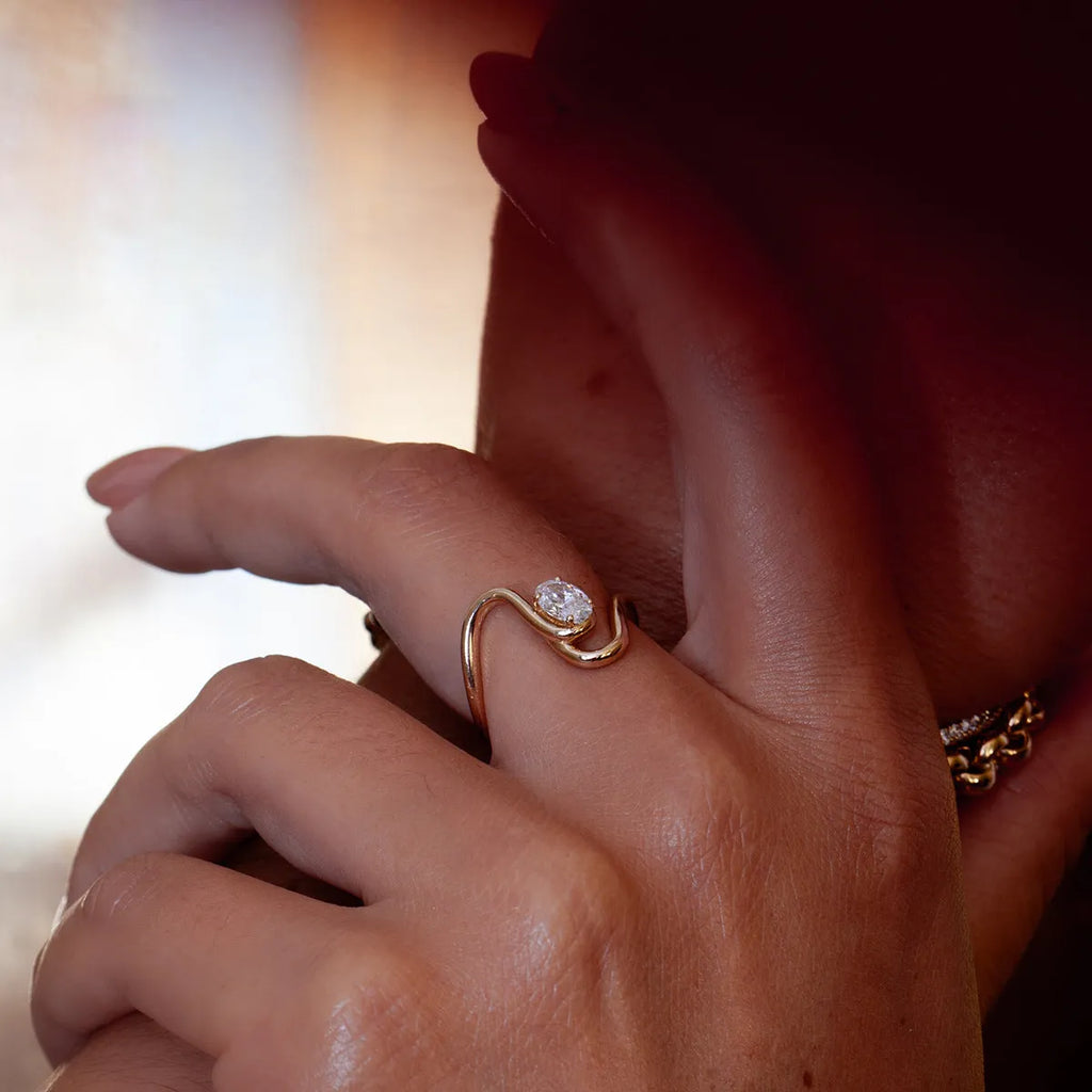 Geometric stainless steel zircon ring with no-fade finish on a hand.