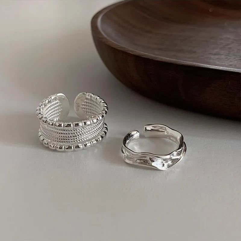 Copper alloy adjustable opening ring with woven twisted multilayer geometry design