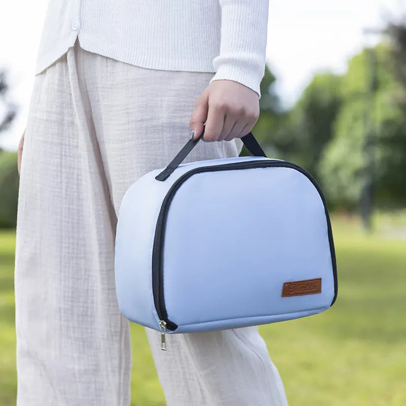 Textured cloth insulated lunch bag in sapphire blue colour with large capacity for a bento box.