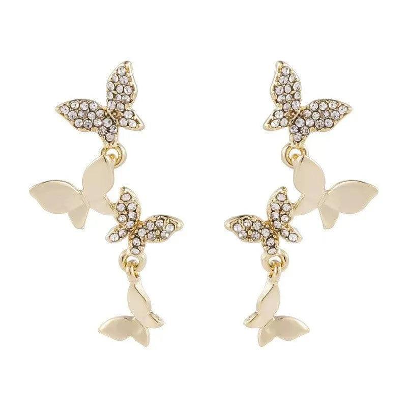 Women's gold-coloured copper butterfly earrings with four drop charms