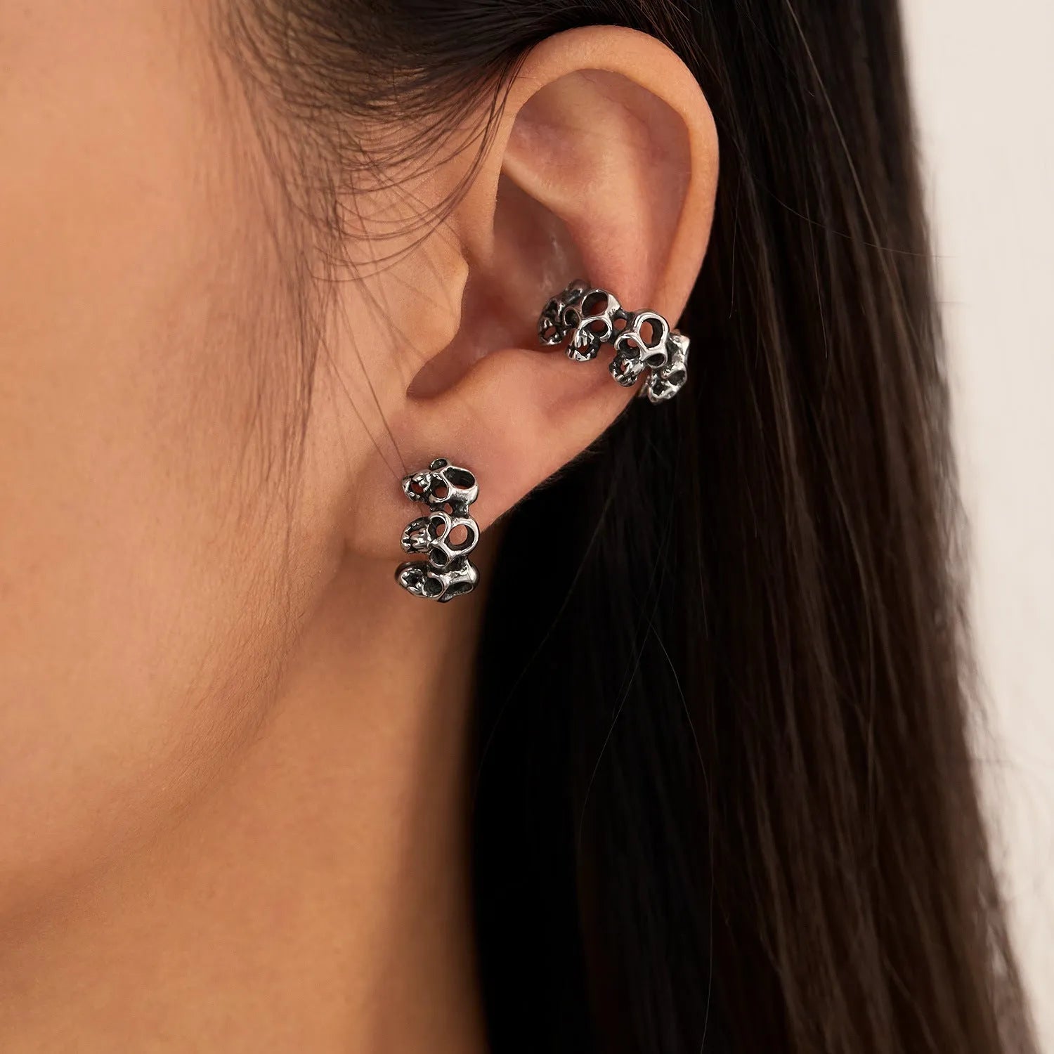 Retro hollow geometric skull earrings in stainless steel with ear clip fitting