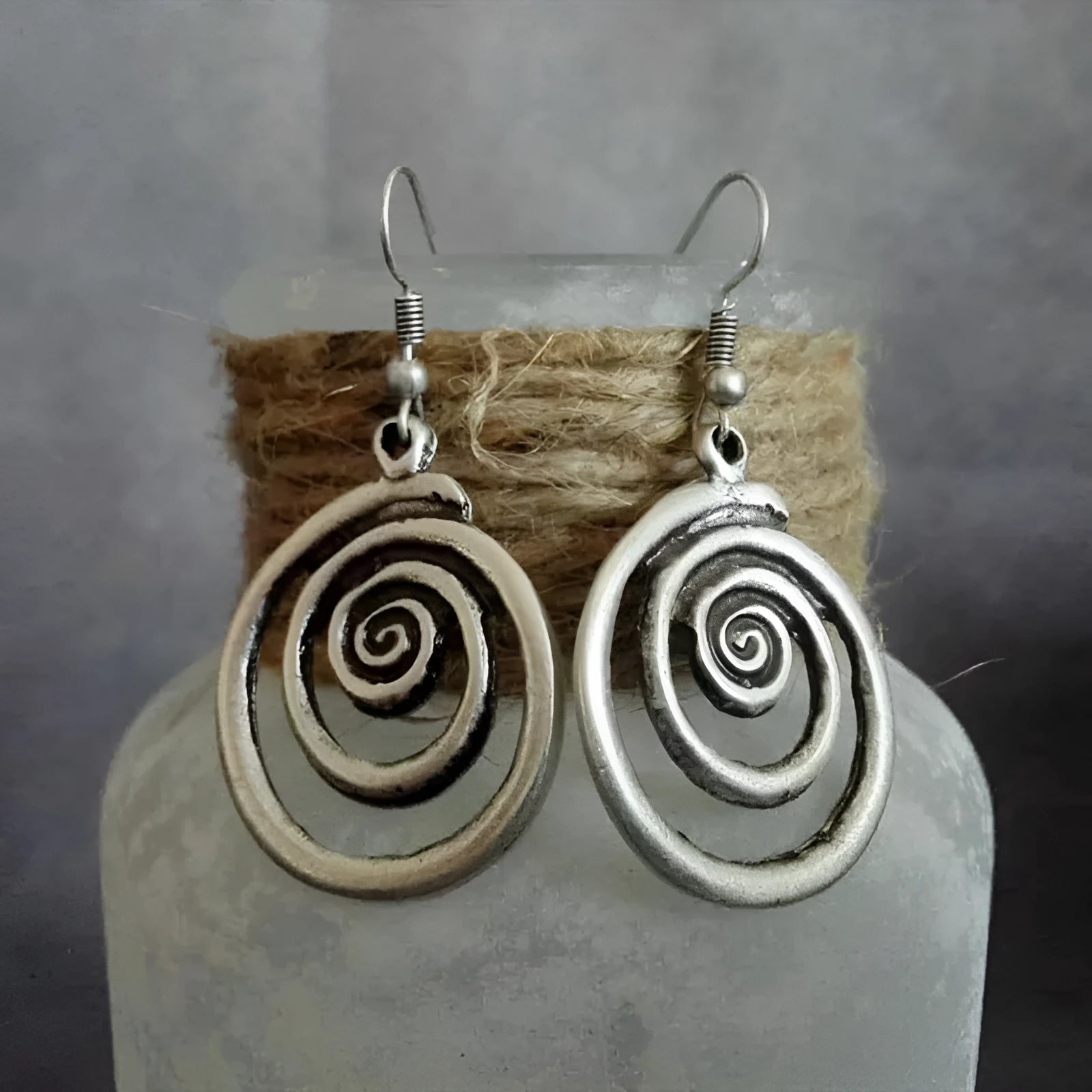 Silver geometric spiral distressed earrings with national style design measuring 2.6x5cm