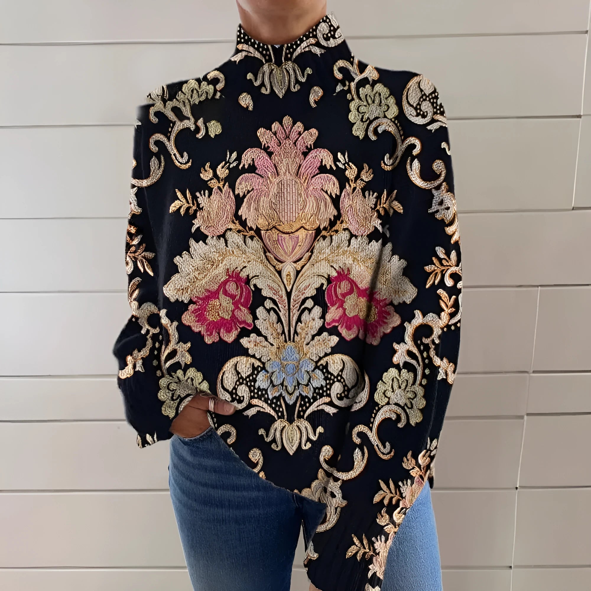 Black long sleeve turtleneck sweater with a raised 3D geometric pattern, shown on a model with a loose fit.