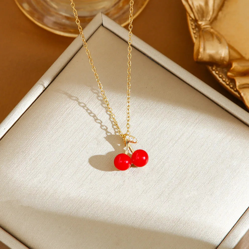 Titanium steel women's necklace with golden cherry pendant and O-ring chain design
