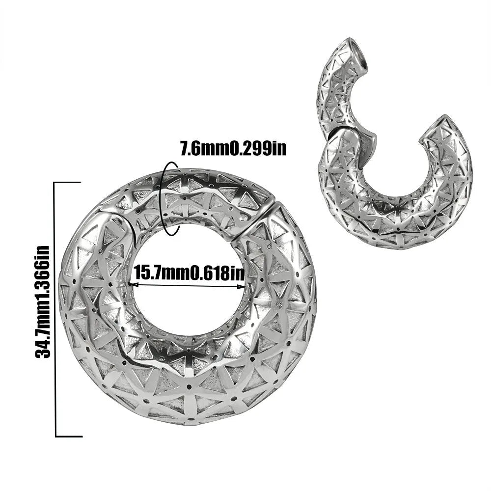 A pair of silver-toned fashion earrings with a geometric totem pattern design on a white background.