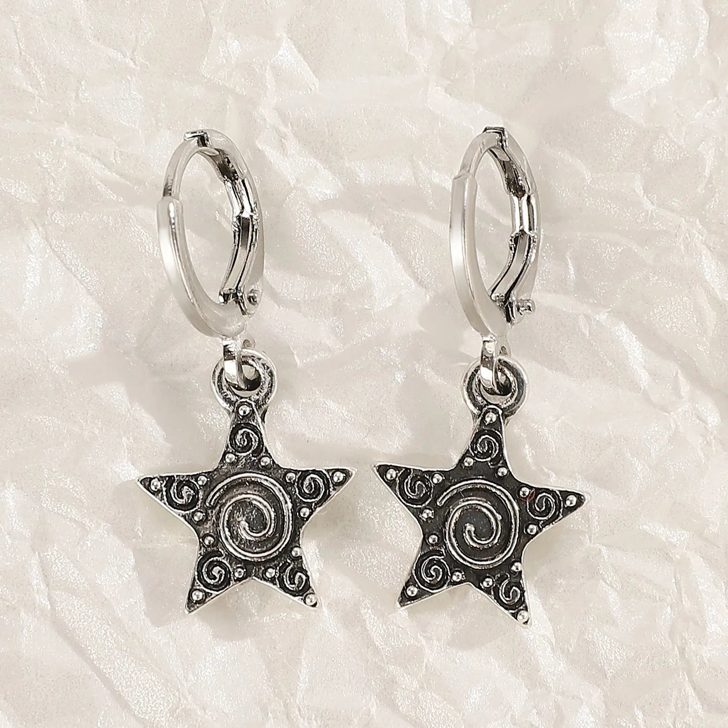 Women's alloy earrings with cross and heart designs in white and antique silver colour variants