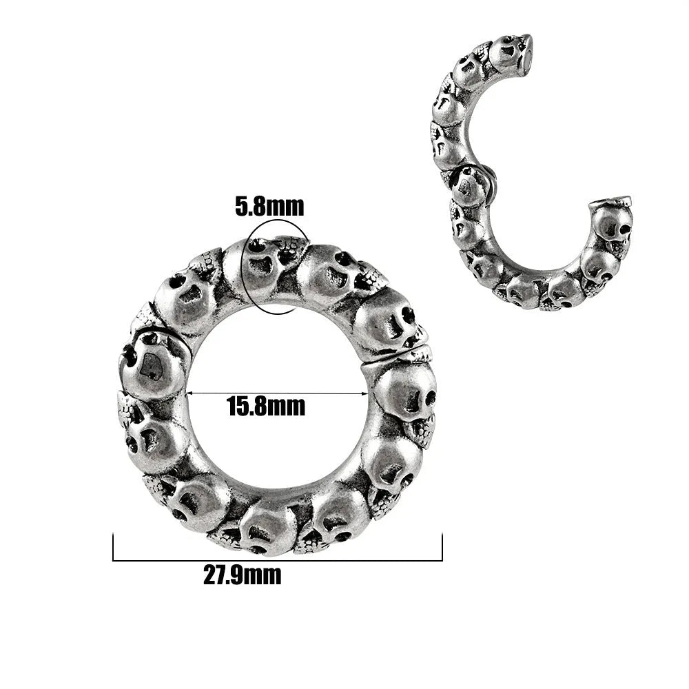 A pair of silver-toned fashion earrings with a geometric totem pattern design on a white background.
