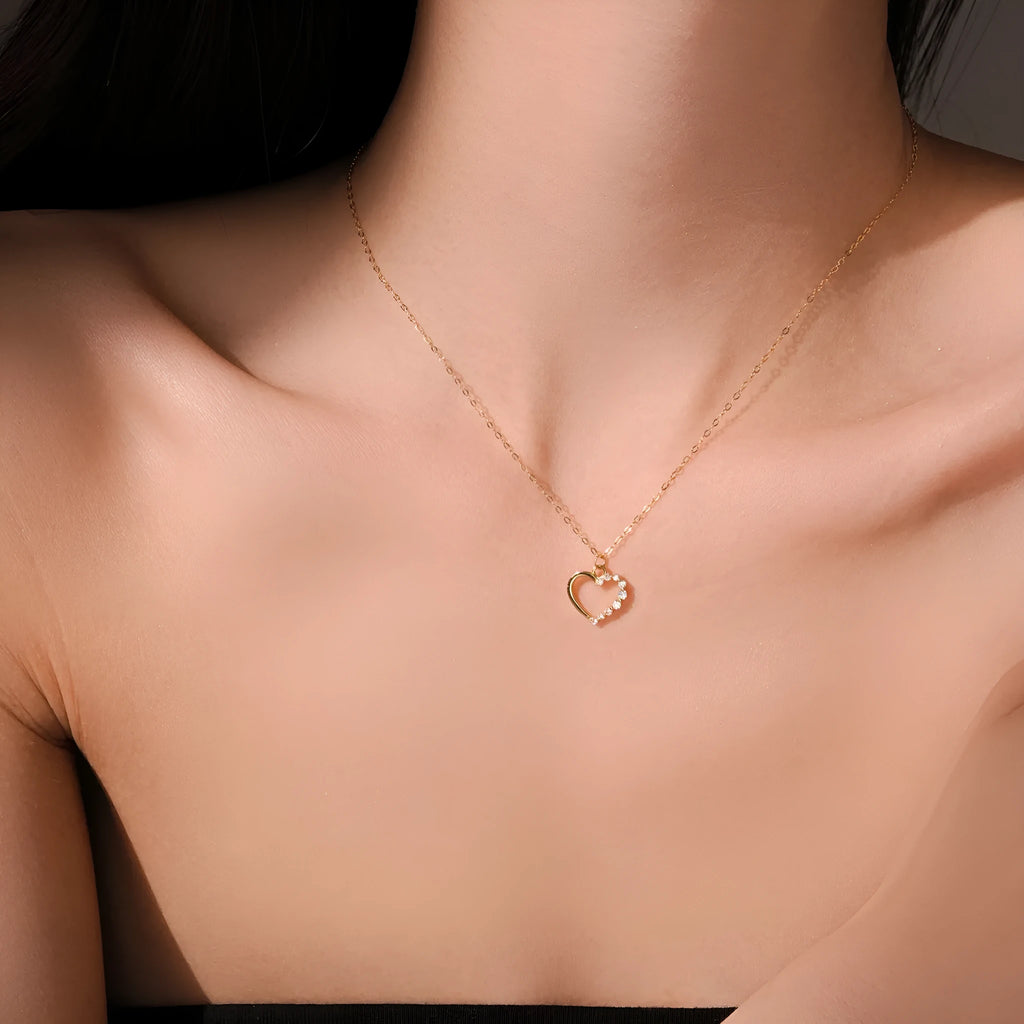 S925 sterling silver hollow heart pendant necklace on a regular chain, available in white gold or 18K gold finish.