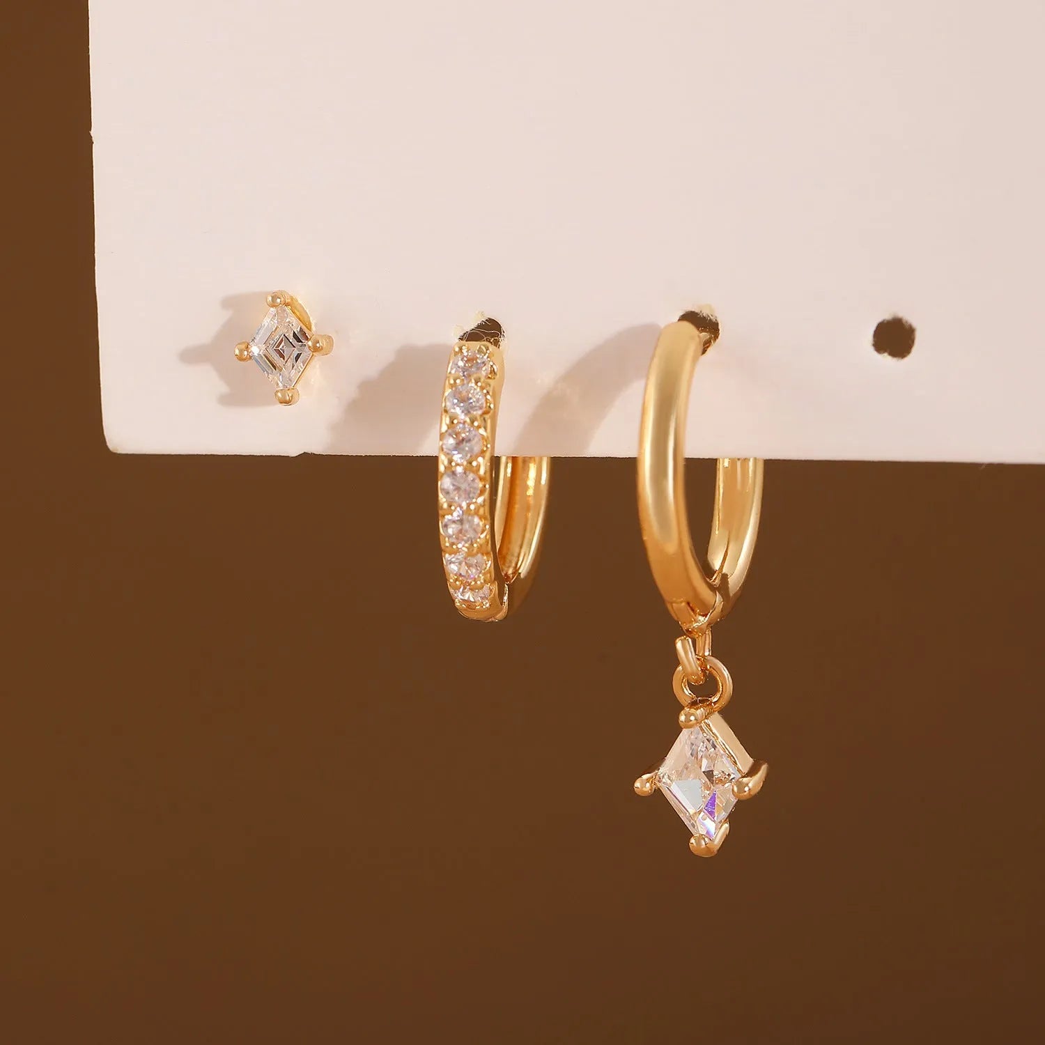 Geometric ladies earring set with three styles featuring zircon stones in gold or white finish