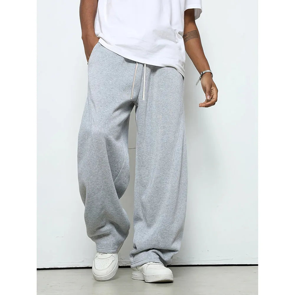 Men's solid colour casual trousers with an elastic waistband and straight leg in a grey shade.
