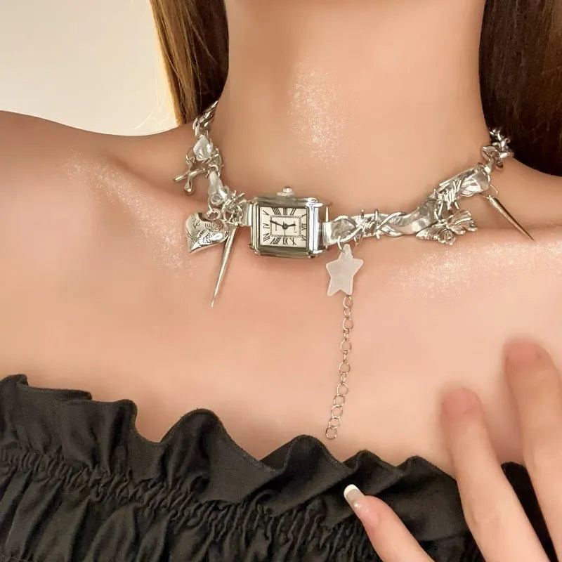 Dark electroplated women's necklace with layered chains, cross pendant, and adjustable length