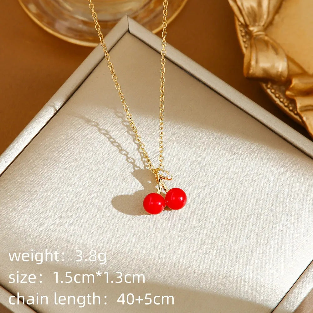 Titanium steel women's necklace with golden cherry pendant and O-ring chain design