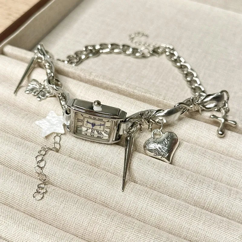 Dark electroplated women's necklace with layered chains, cross pendant, and adjustable length