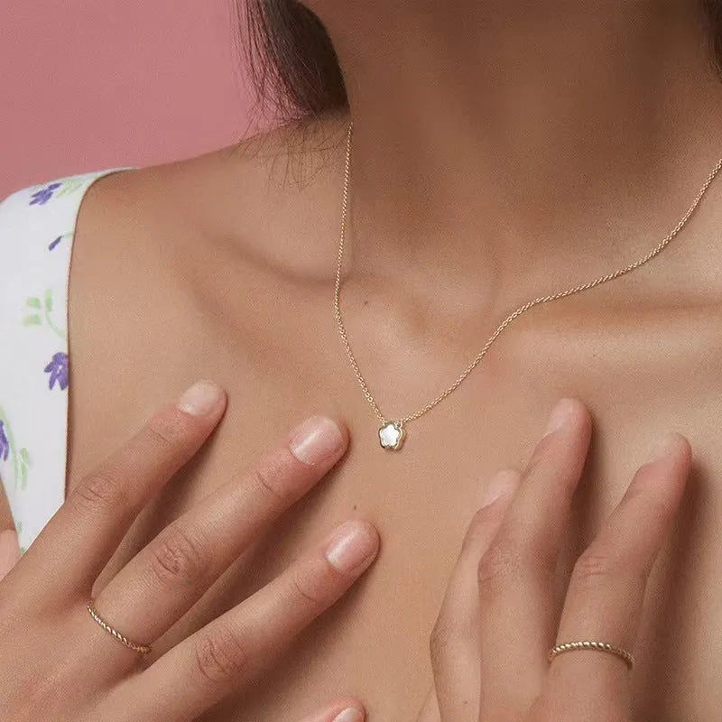 Women's flower necklace with white mother shell pendant on copper chain in gold and silver tones
