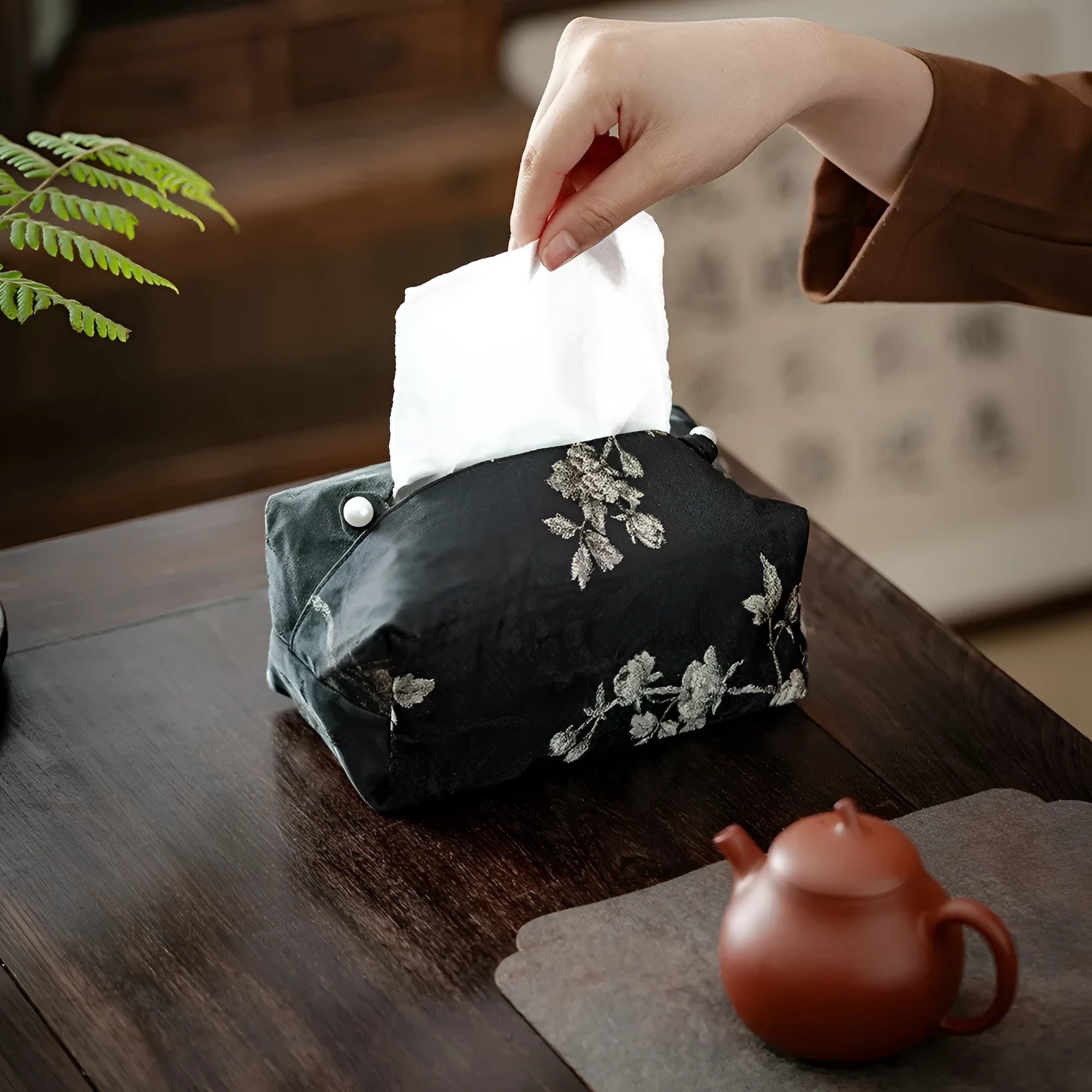 Chinese brocade fabric tissue box with embroidered white plum pattern, approximately 17 cm wide