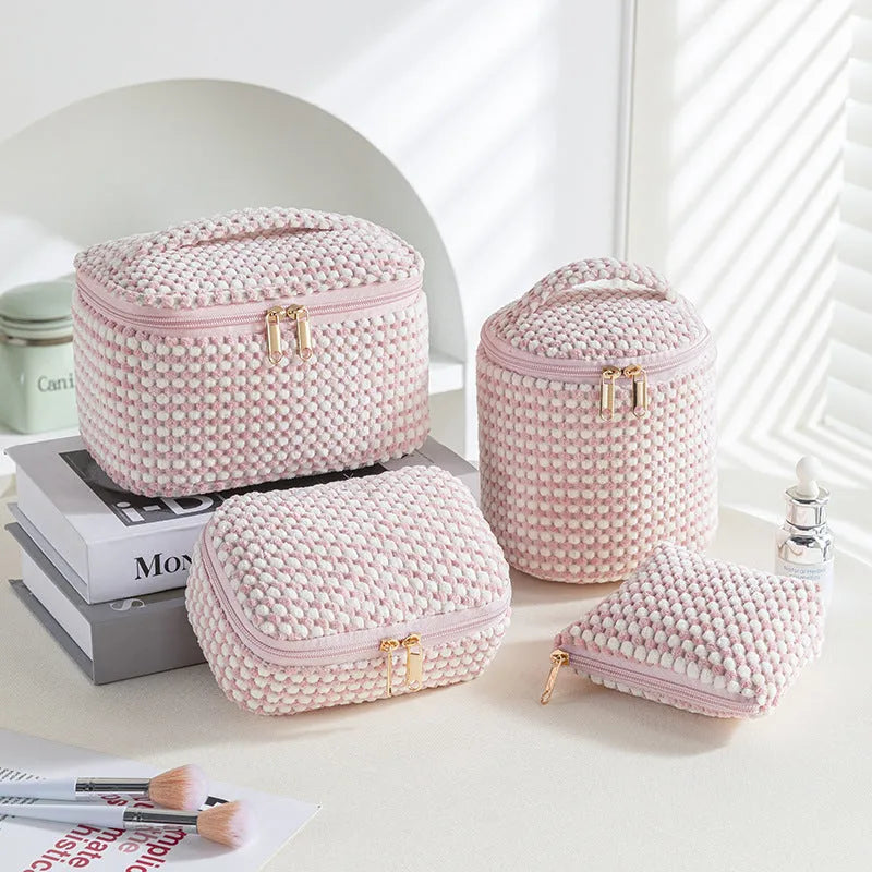 Four-piece polyester makeup bag set in cube style with modern simple design