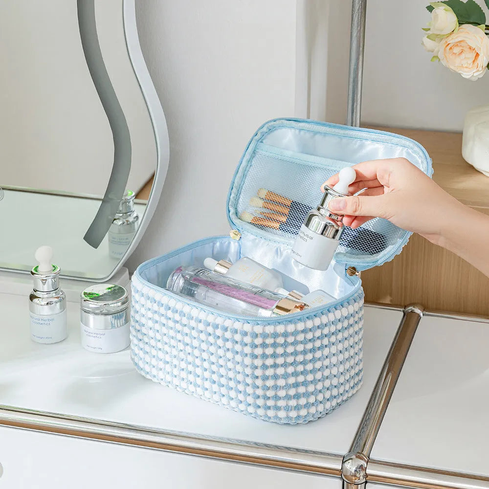 Four-piece polyester makeup bag set in cube style with modern simple design