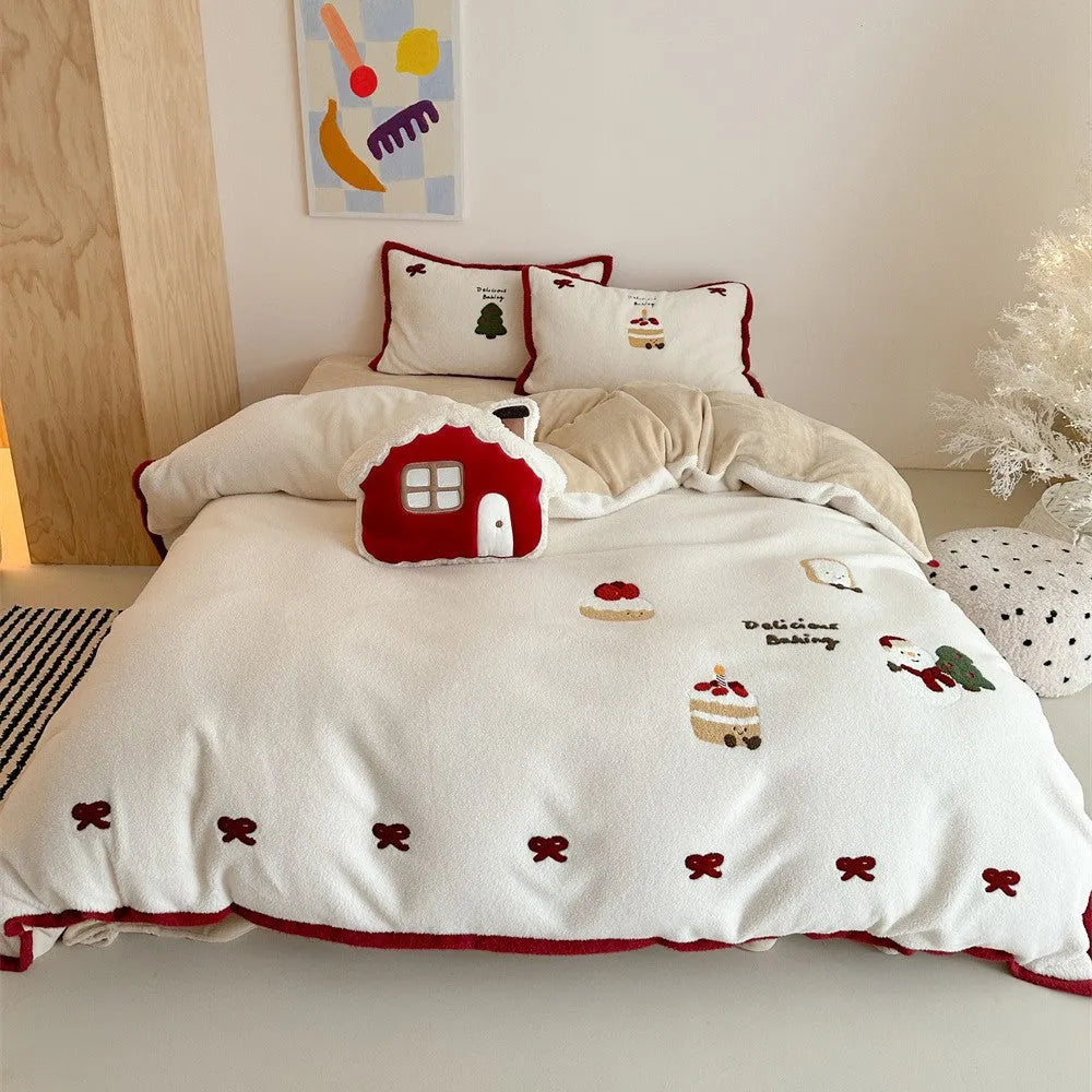 Winter Christmas cartoon patterned bed linen four-piece set on a bed, showing duvet cover and pillowcases.