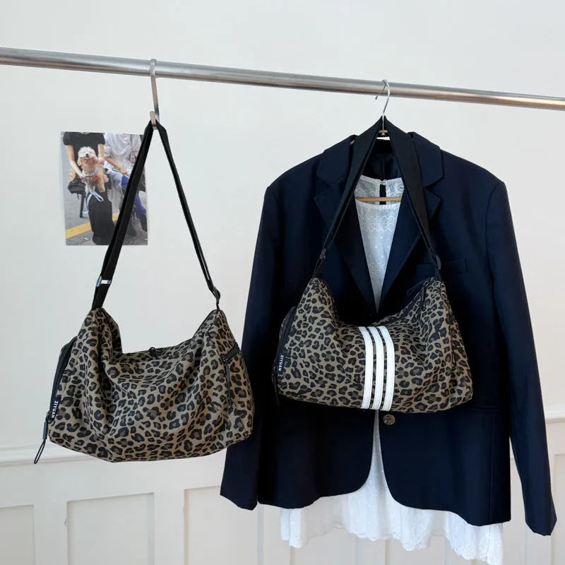 Sports style shoulder messenger bag in leopard print pattern with cross-body strap
