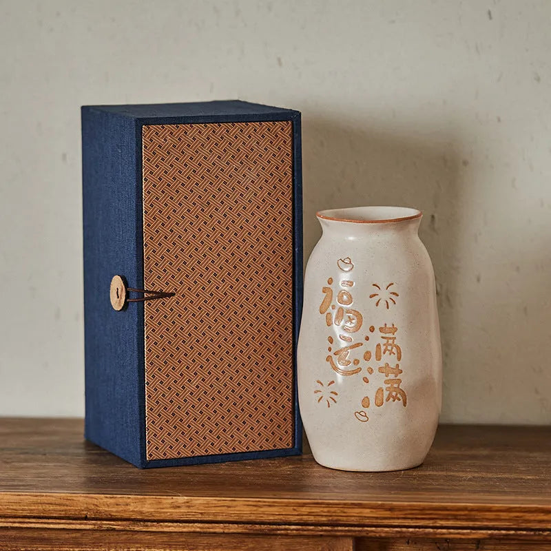 Chinese hand-painted ceramic vase with persimmon fruit designs on wooden desktop