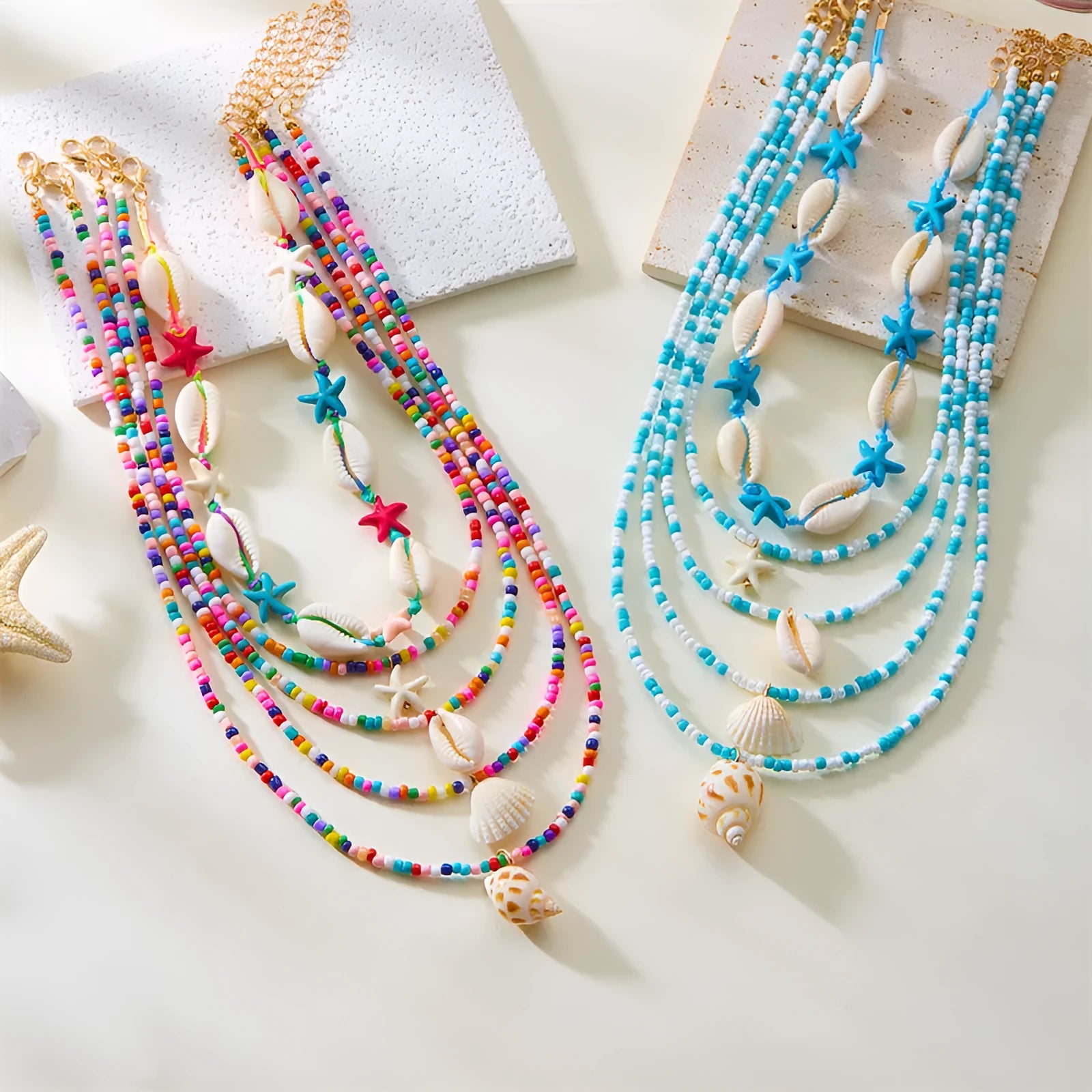 Women's five-layer shell and conch bead necklace set with adjustable chain on blue background