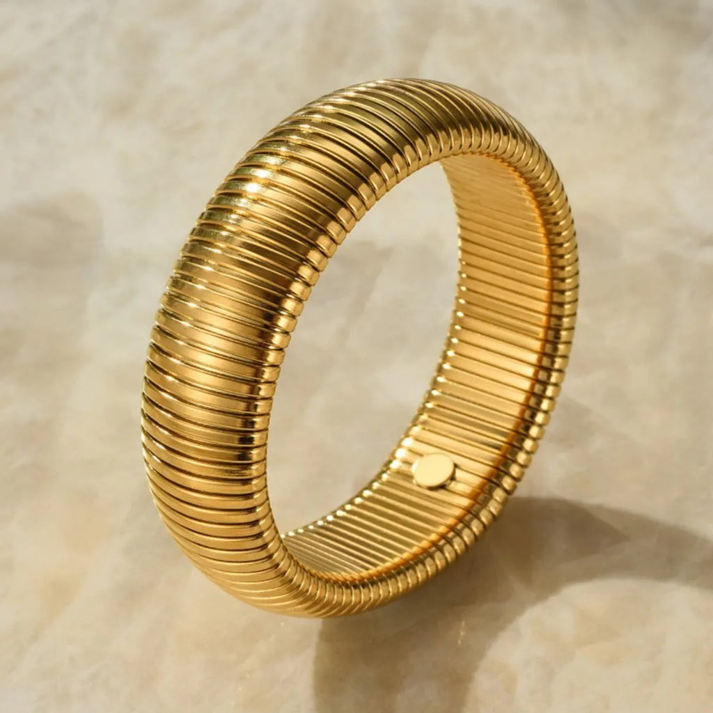 Women's titanium steel elastic bracelet with vertical stripe pattern in gold or silver colour