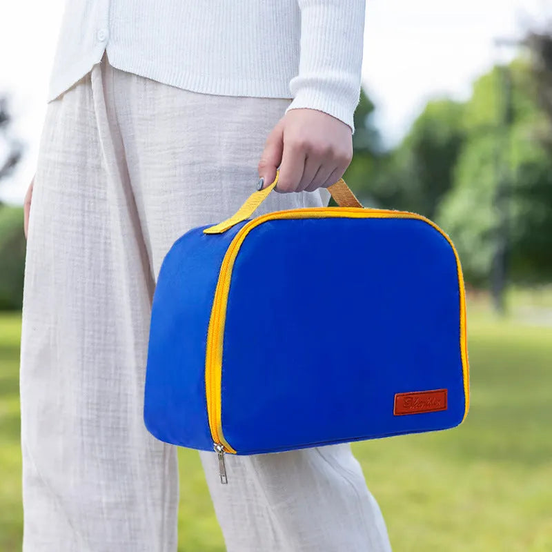 Textured cloth insulated lunch bag in sapphire blue colour with large capacity for a bento box.