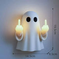 White ghost statue Halloween night lamp with LED lighting on black background