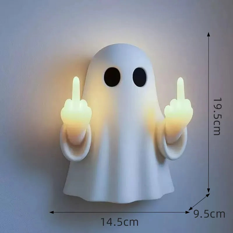 White ghost statue Halloween night lamp with LED lighting on black background