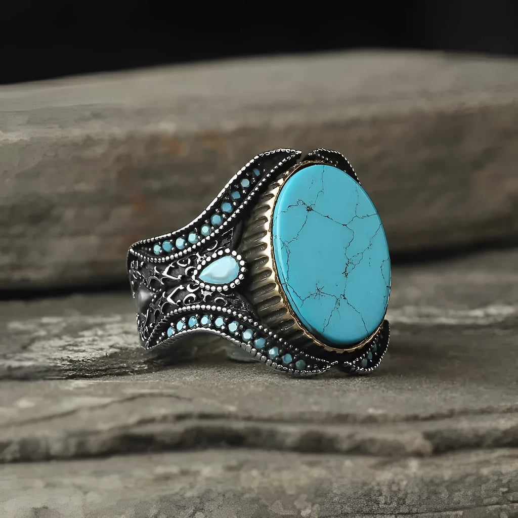 Men's round turquoise ring with antique silver alloy finish showing simple stone setting