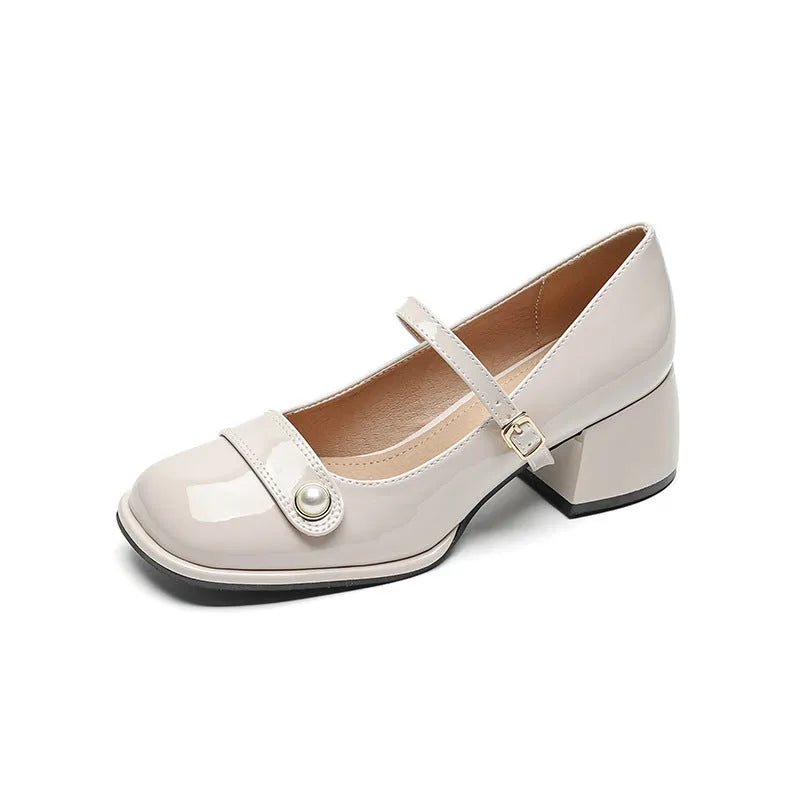 French-style chunky heel hiking pumps in patent leather with square toe and buckle