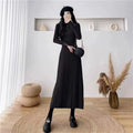 A women's solid colour A-line woollen skirt with a high waist, shown in a mid-length below-the-knee cut.