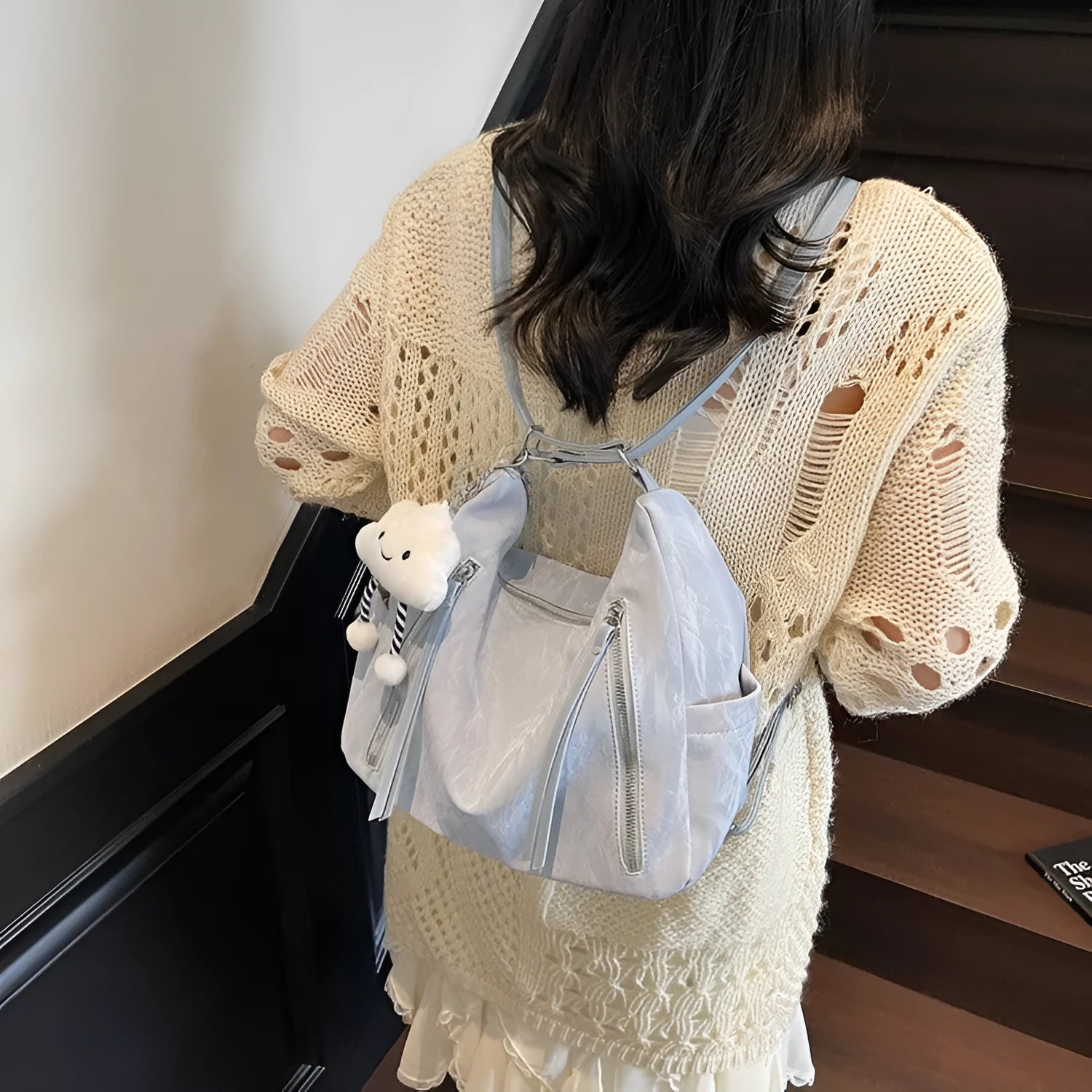 Women's soft PU fashion backpack in blue colour with pendant accessory attached