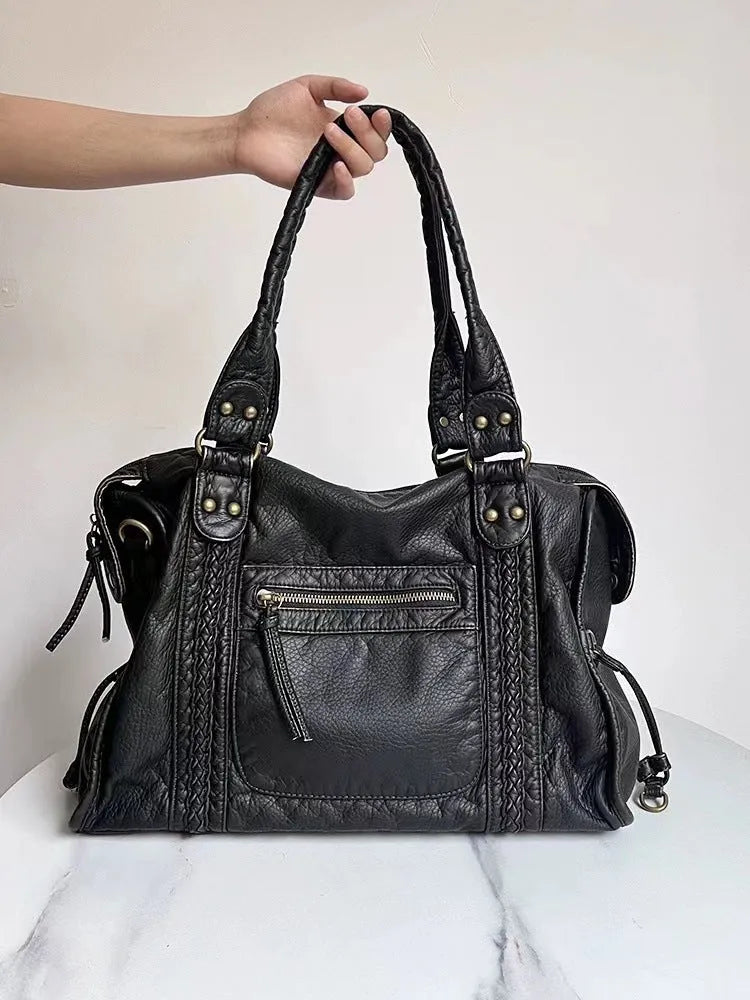 Women's retro motorcycle shoulder messenger bag in soft PU leather with woven design and internal organisation pockets